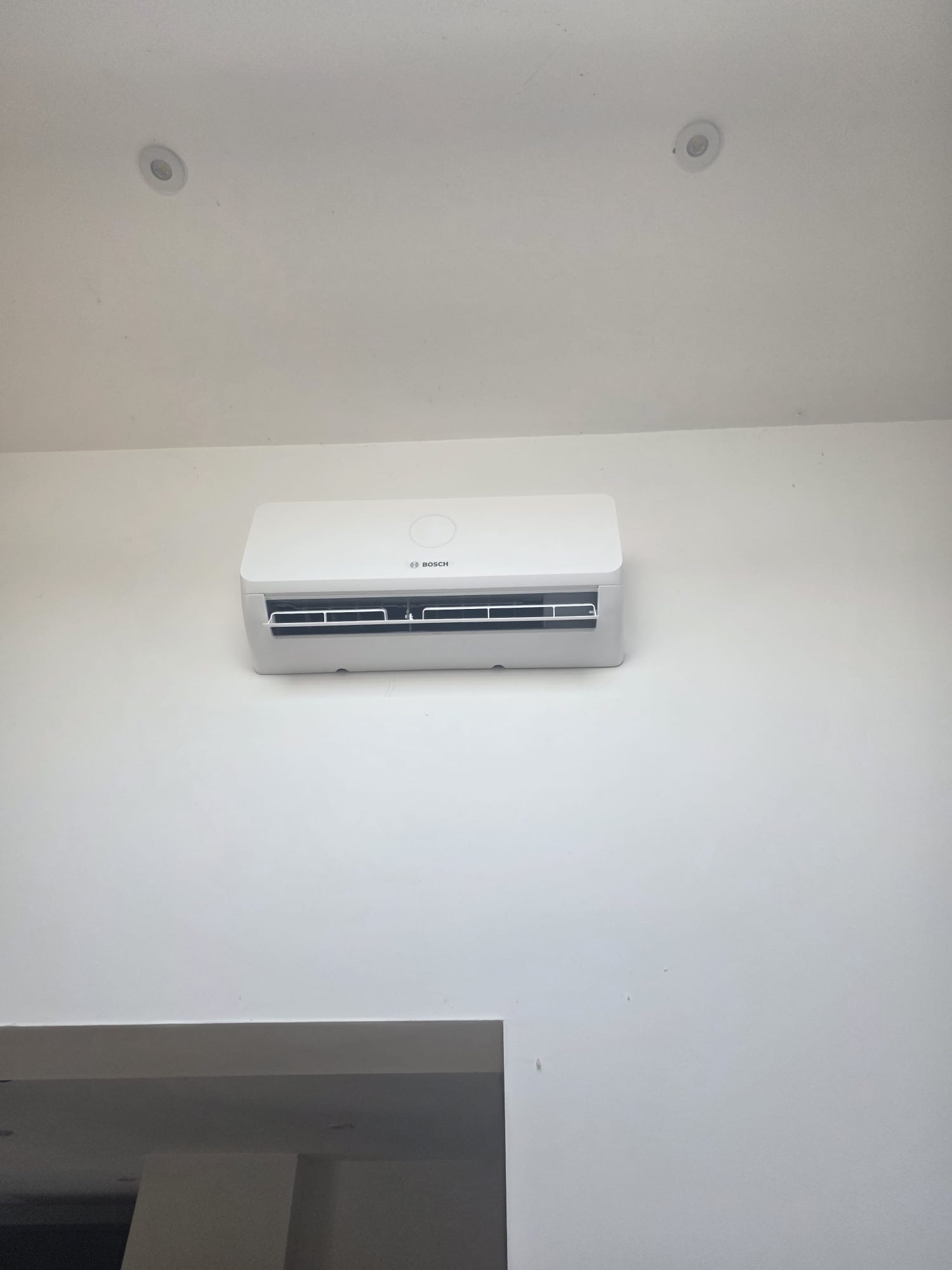 Bosch wall-mounted air conditioning unit fitted in a home in Hurstpierpoint